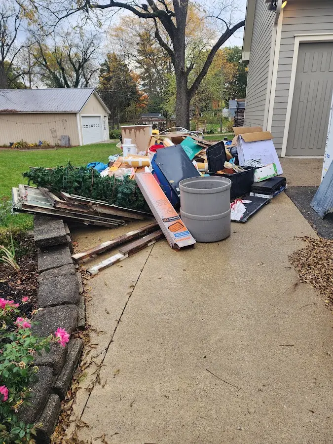Dumpster being loaded with debris for 12 Yard Dumpster Rental in San Clemente